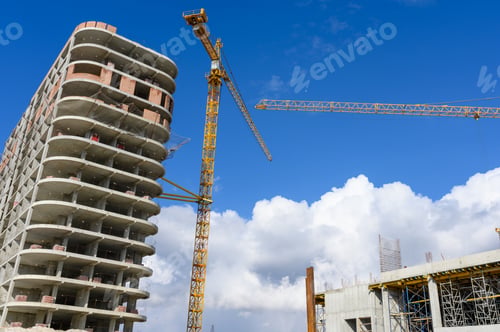 Preview: Crane and building construction site against blue sky