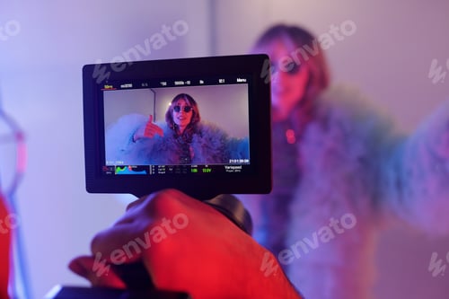 Preview: Woman on Video Screen Wearing Feathery Jacket