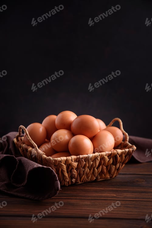 Preview: Basket of fresh farm chicken eggs on a wooden rustic background