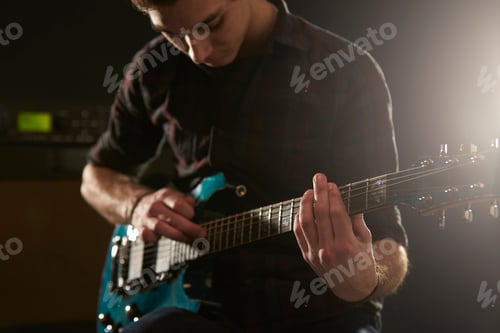 Preview: Close Up Of Man Using Tapping Technique On Electric Guitar