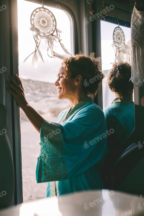 Preview: Happy traveler female smile and enjoy outdoors view standing on the door of her van. Travel holiday