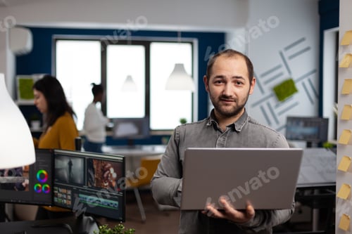 Preview: Creative video editor worker standing in front of camera