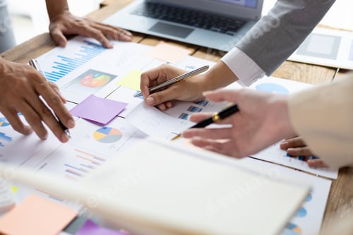 Preview: Business people discuss marketing growth chart and make business plan.