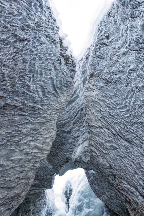 Preview: Ice cave with rock formation of water eroded on winter