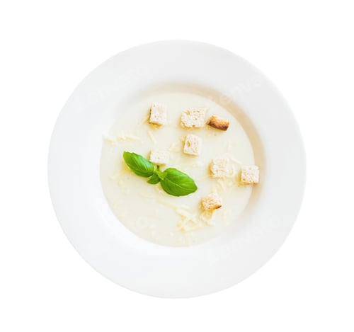Creamy Soup with Croutons and Basil Leaves