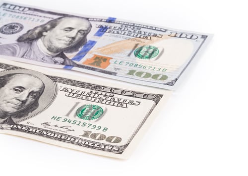 Preview: One Hundred Dollar Bills Stacked on White Background