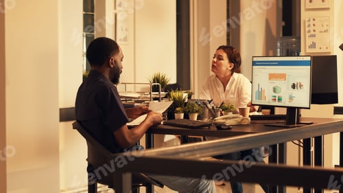 Preview: Diverse people working with marketing sales to plan project report