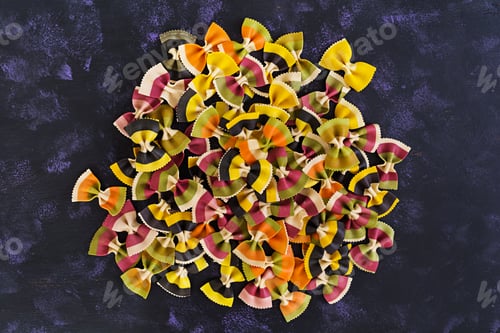 Preview: Mixed colorful farfalle pasta. Flat lay. Top view.