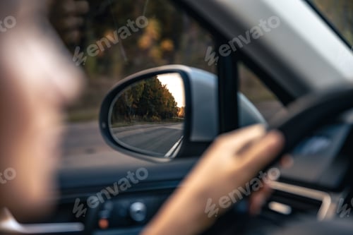Preview: The view of the road in the car's rearview mirror.