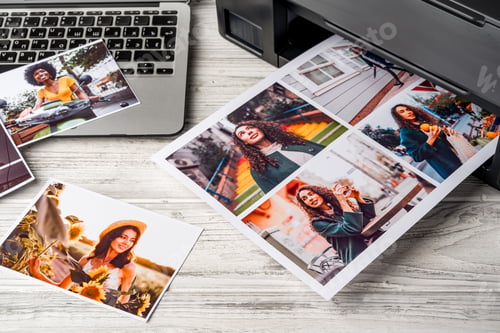 Preview: Computer laptop and printer on table. Printing photos