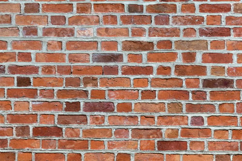 Preview: Natural old vintage weathered red brown solid brick wall. Abstract copy space background.