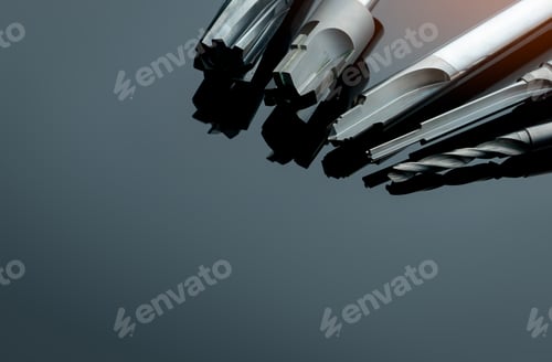 Preview: Special tools isolated on dark background. Made to order special tools. Coated step drill and reamer