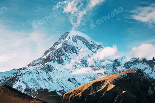 Preview: Georgia. Peak Of Mount Kazbek Covered With Snow. Amazing Georgian Nature Landscape In Winter Sunny