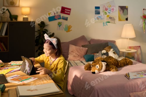 Preview: Girl Drawing Digital Art on Tablet in Cozy Bedroom Environment