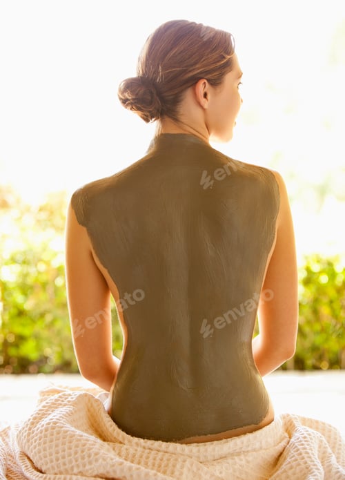 Preview: Caucasian woman with mud treatment on back