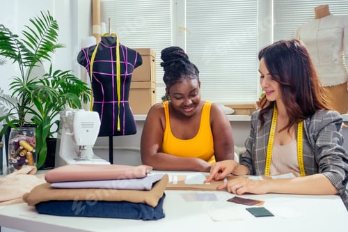 Preview: beautiful woman seamstress with long hair and afro customer