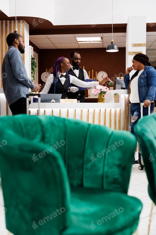 Preview: Front desk agent check in hotel guests