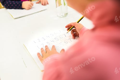 Preview: Children learning to write in the area of literacy in a montessori school.