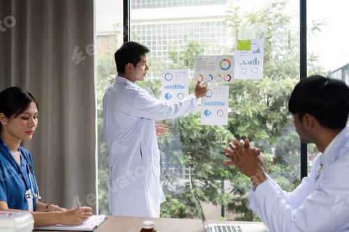 Preview: Doctor leading a meeting discussing patient data and outcomes