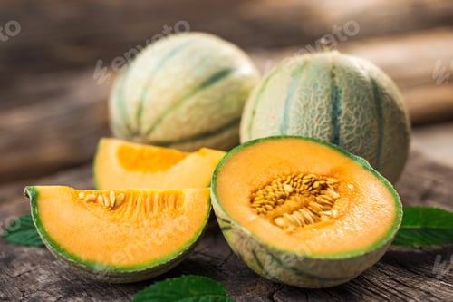 Preview: Fresh melons on wooden table