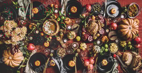 Preview: Flat-lay of Thanksgiving celebration dinner table with readitional Autumn food