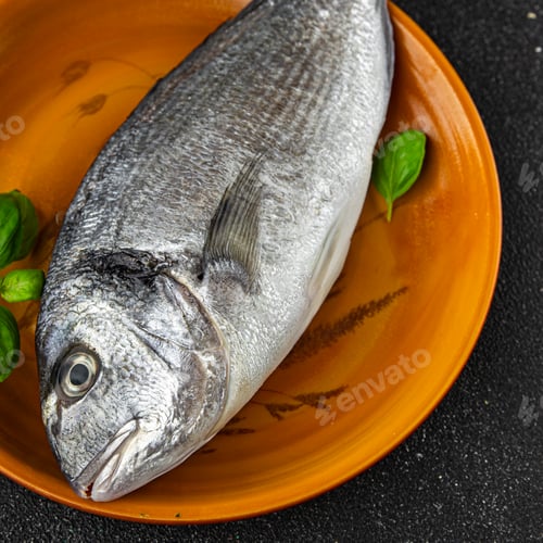 Preview: raw fish sea bream seafood fresh cooking snack appetizer meal food on the table copy space food