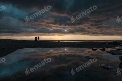 Preview: Man fishing at sunrise on the line of horizon