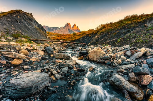 Preview: Landscape of iconic three peak and waterfall flowing of Aiguilles d'Arves in French alps