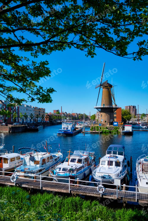Preview: View of the harbour of Delfshaven and the old grain mill De Destilleerketel. Rotterdam, Netherlands