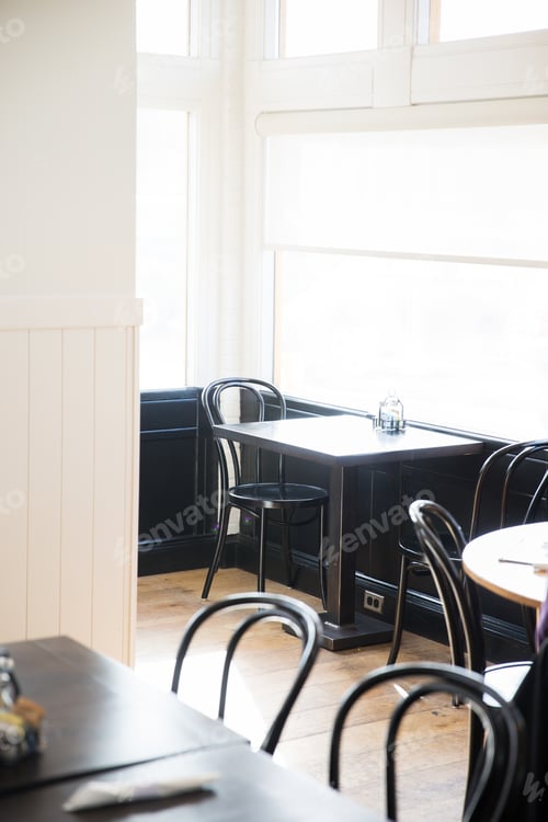 Preview: An empty cafe table next to a window