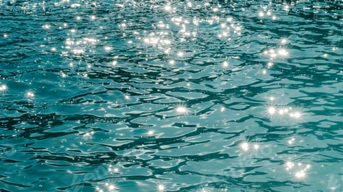 Preview: Scenic view of sunlight on a calm turquoise sea in Ibiza, Spain