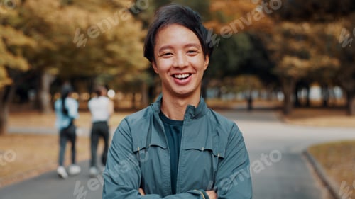 Vista previa: Happy, crossed arms and portrait of man in nature for fitness, health and wellness exercise. Outdoo