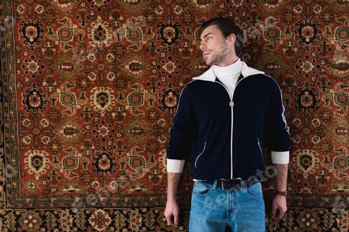 Preview: handsome young man in vintage clothes lying rug