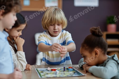 Preview: Diverse group of little kids playing board game together in preschool