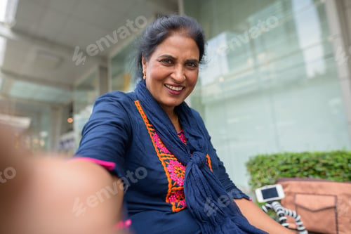 Preview: Personal point view of mature Indian woman taking selfie