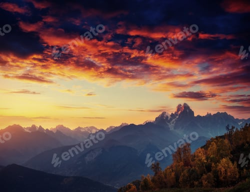 Preview: Autumn landscape and snowy mountain peaks. Fantastic sunset. Vie