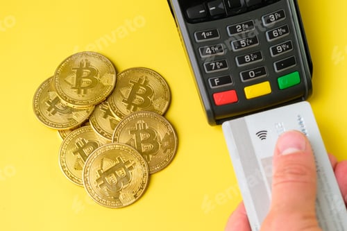 Preview: Bitcoin coins vs credit card payment using POS payment terminal on the yellow background