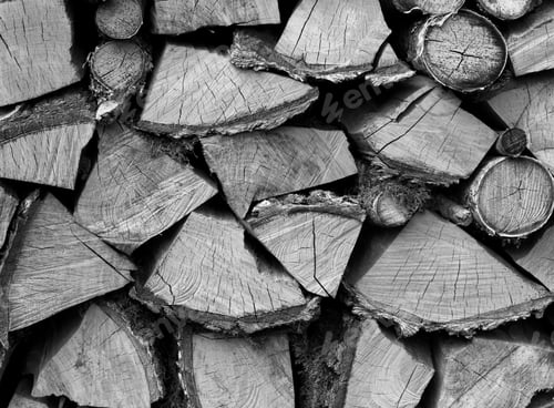 Preview: Background of dry chopped firewood logs in a pile, black and white