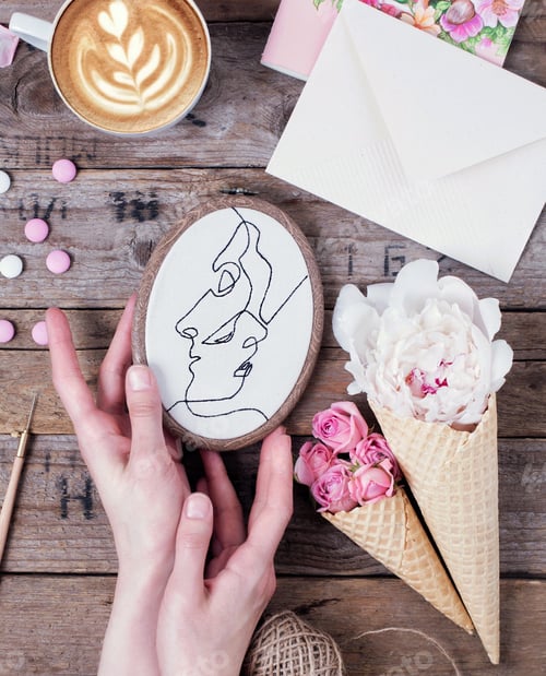 Preview: Flatlay with hand embroidery , cup of coffee and flowers