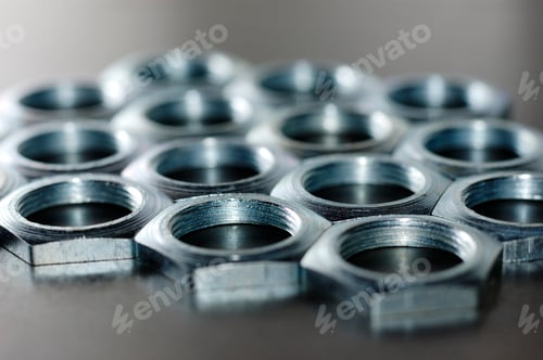 Preview: Close-up chrome metal nuts. Metal lines