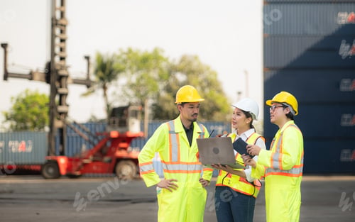 Preview: Group of engineers working with laptop in the container yard