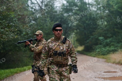 Preview: A disciplined and specialized military unit, donned in camouflage, strategically patrolling and