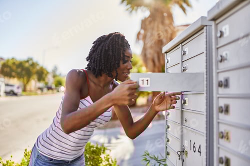 Preview: african american woman checking mail in las vegas