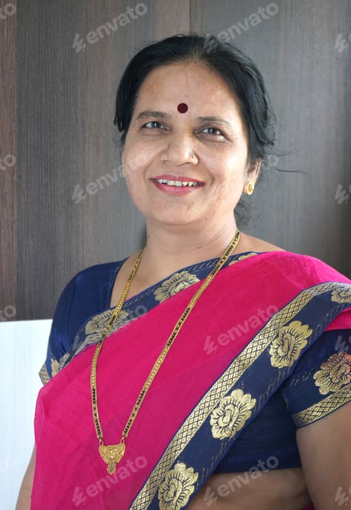 Preview: Portrait of happy Indian woman at her home