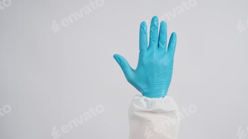 Preview: Gloved Hand Protecting Against White Background