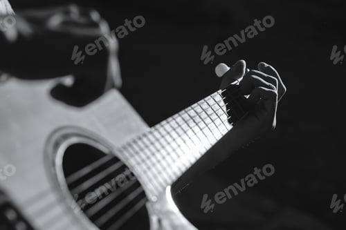 Preview: Boy plays the guitar.