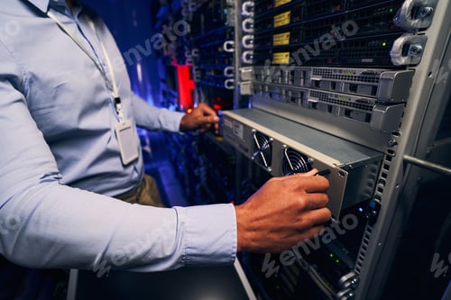 Preview: Engineer carrying out data center equipment upgrade