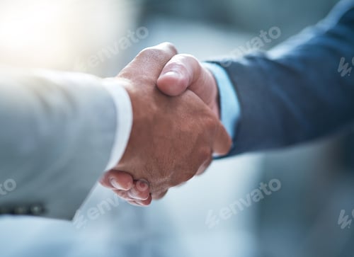 Preview: Cropped shot of two unrecognizable businessmen shaking hands after making a deal in the office