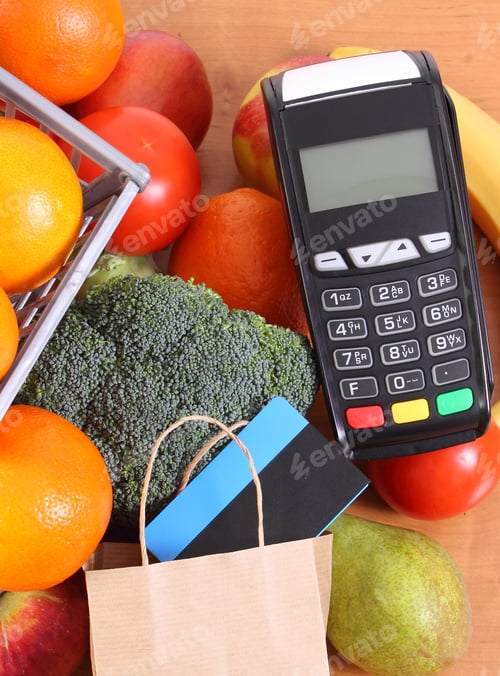 Preview: Payment terminal, contactless credit card, paper shopping bag and fruits with vegetables