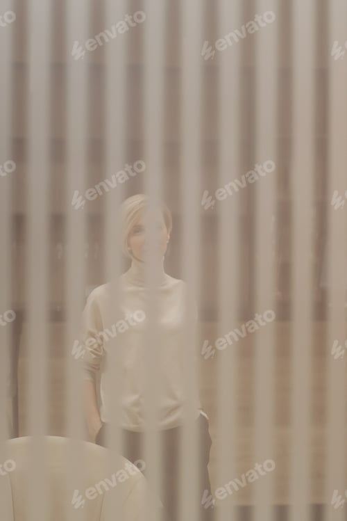 Preview: Blonde Woman Posing in a Minimalist Setting